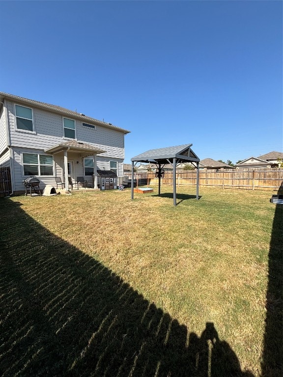 view of yard featuring a gazebo and a patio area