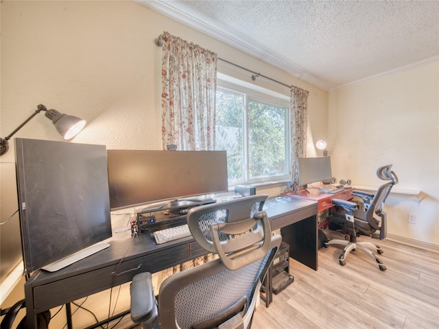 office featuring ornamental molding, light hardwood / wood-style floors, and a textured ceiling