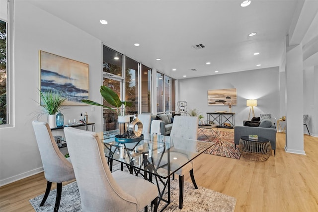 dining room with a healthy amount of sunlight and light wood-type flooring