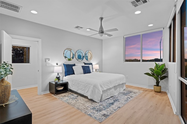 bedroom featuring light wood-type flooring and ceiling fan