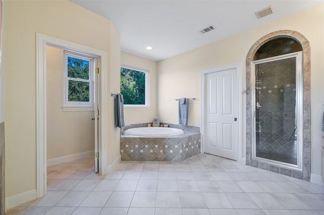 bathroom featuring plus walk in shower and tile patterned floors