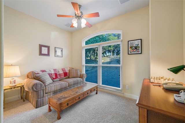 living room with ceiling fan and light colored carpet