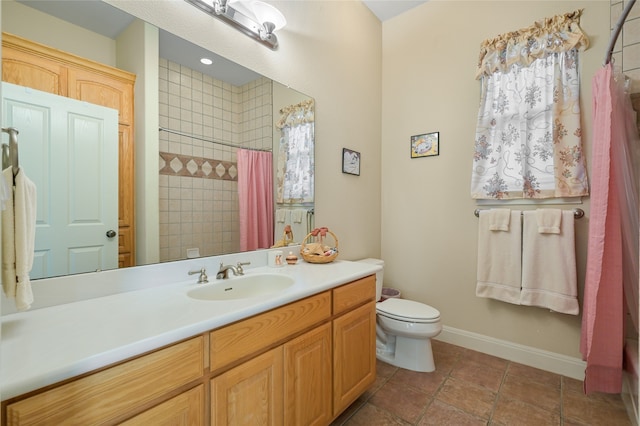 bathroom featuring vanity, curtained shower, tile patterned floors, and toilet