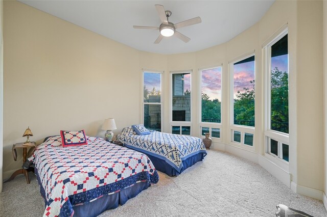 bedroom with ceiling fan and carpet floors