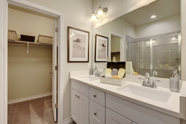 bathroom with vanity and a shower with shower door