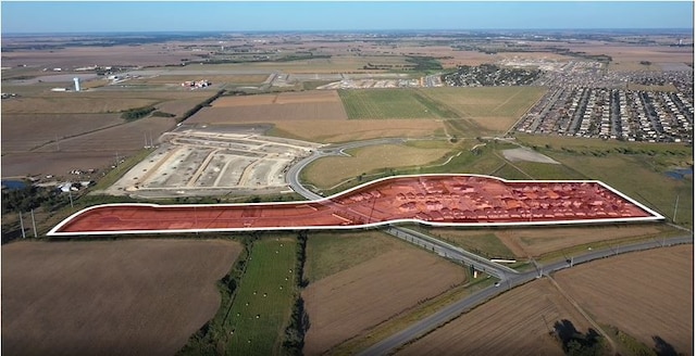 birds eye view of property with a rural view