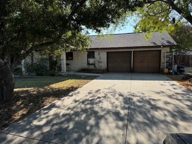 single story home featuring a garage