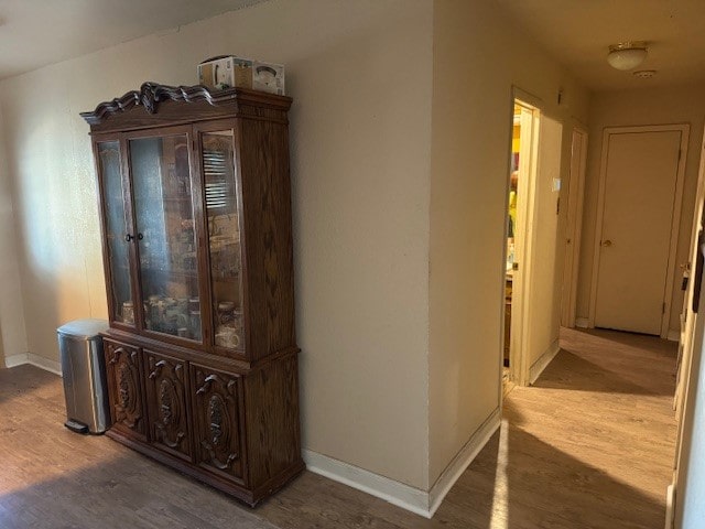 corridor featuring hardwood / wood-style flooring