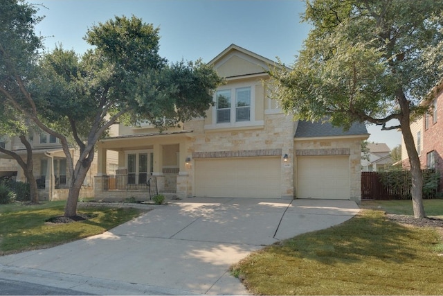 view of front of property featuring a garage and a front lawn