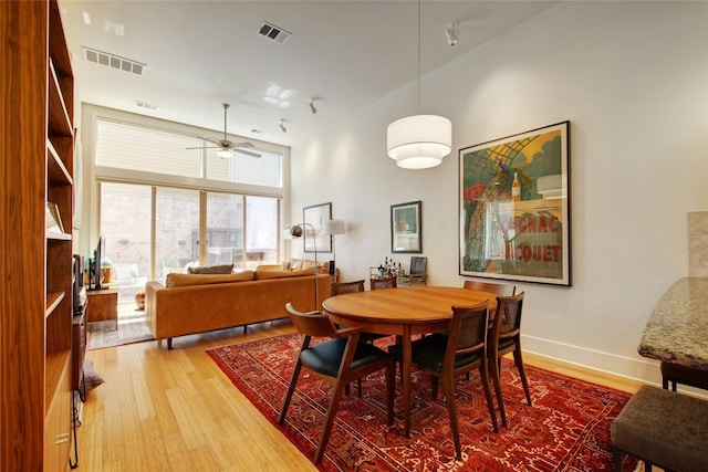 dining room featuring hardwood / wood-style floors and ceiling fan