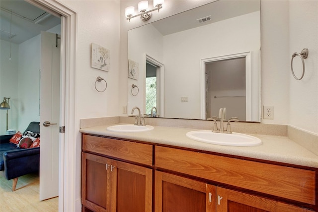 bathroom featuring vanity and hardwood / wood-style flooring