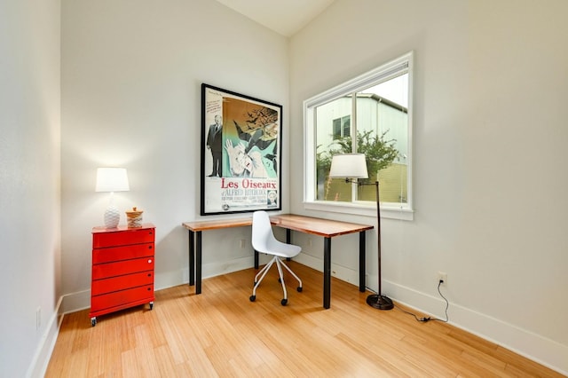 office with light wood-type flooring