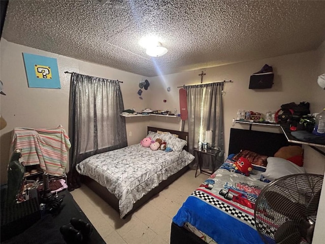 bedroom featuring a textured ceiling