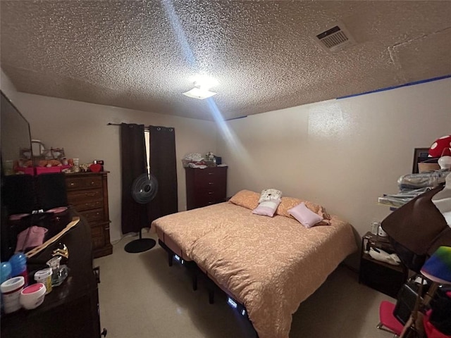 carpeted bedroom featuring a textured ceiling