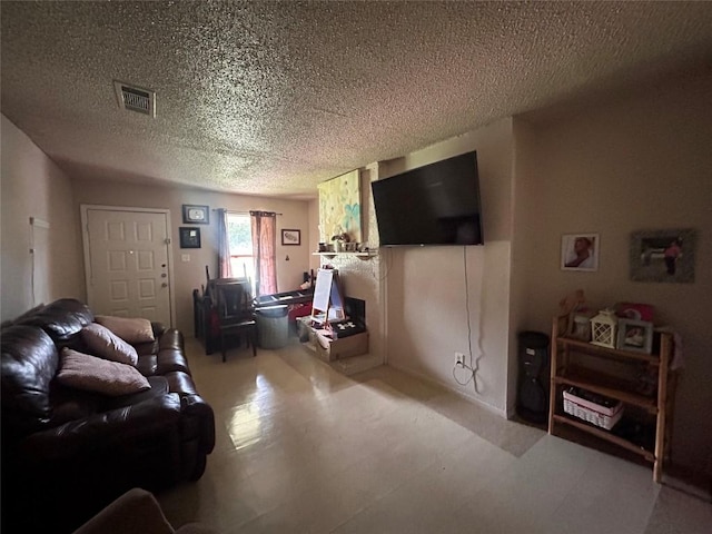 living room featuring a textured ceiling