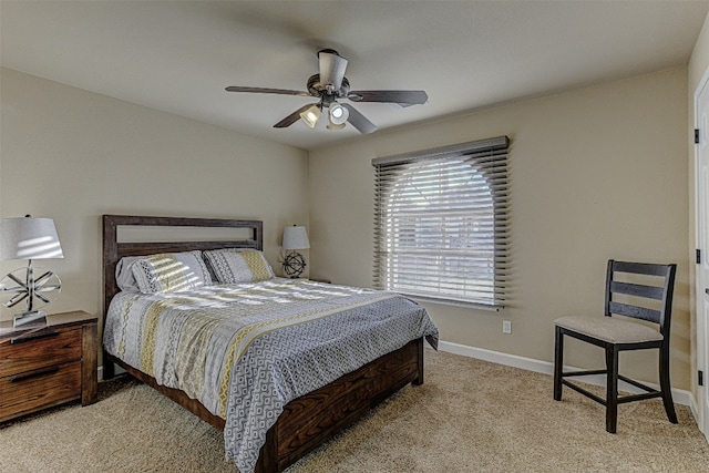 bedroom featuring light colored carpet and ceiling fan