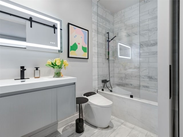 full bathroom with toilet, vanity, and tiled shower / bath