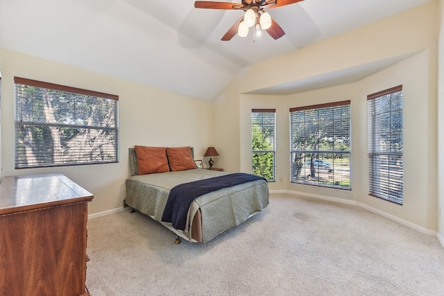 bedroom with light carpet, ceiling fan, and lofted ceiling