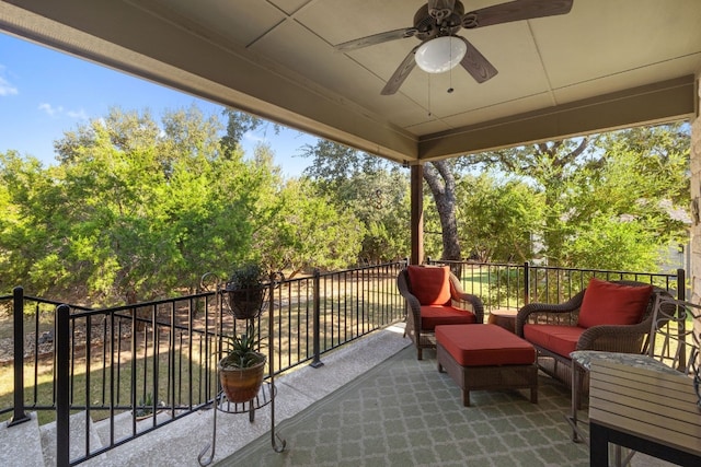 view of patio / terrace with ceiling fan and a balcony