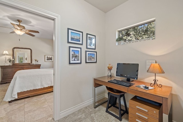 tiled home office featuring ceiling fan