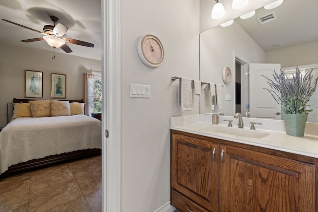 bathroom featuring ceiling fan, vanity, and tile patterned flooring