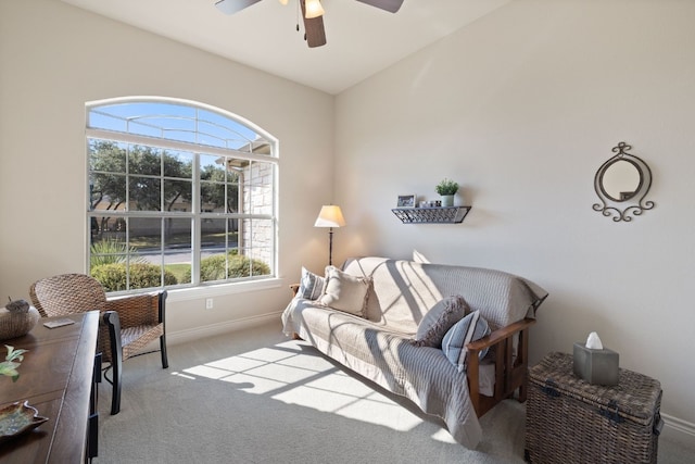 living room featuring plenty of natural light, lofted ceiling, light carpet, and ceiling fan