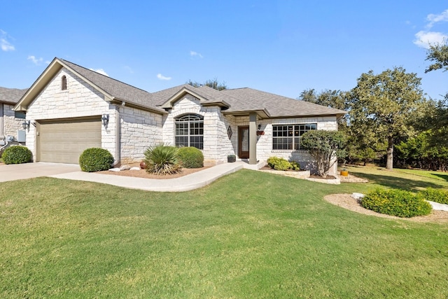 view of front of house featuring a garage and a front yard