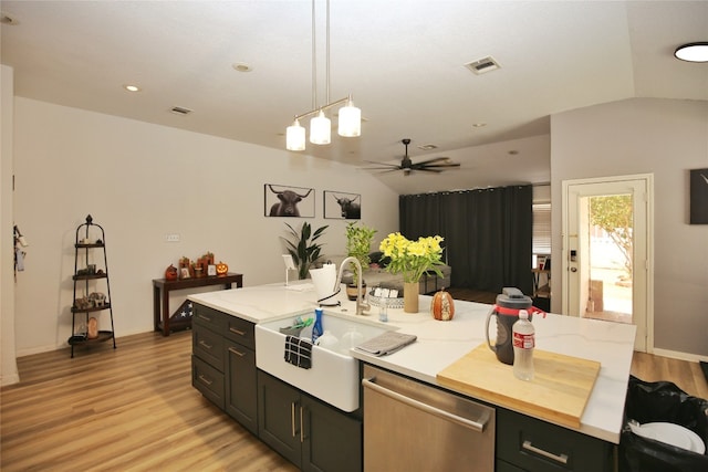 kitchen featuring light hardwood / wood-style floors, ceiling fan, pendant lighting, lofted ceiling, and stainless steel dishwasher