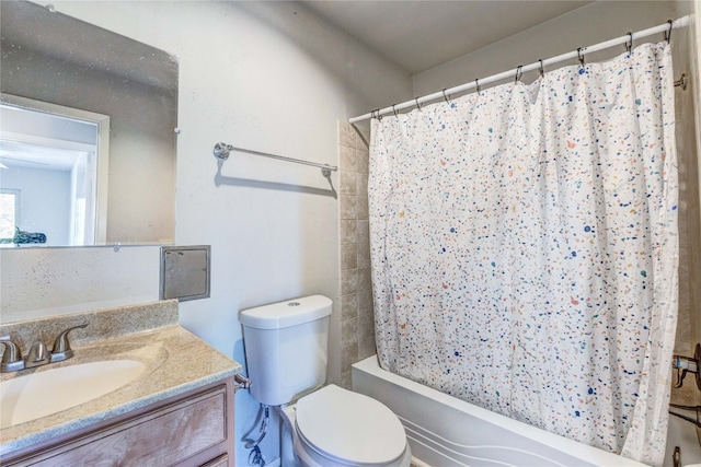 full bathroom with vanity, toilet, and shower / bathtub combination with curtain