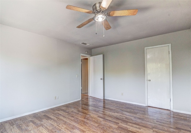 empty room with wood-type flooring and ceiling fan