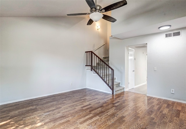 unfurnished room with hardwood / wood-style flooring, ceiling fan, and vaulted ceiling