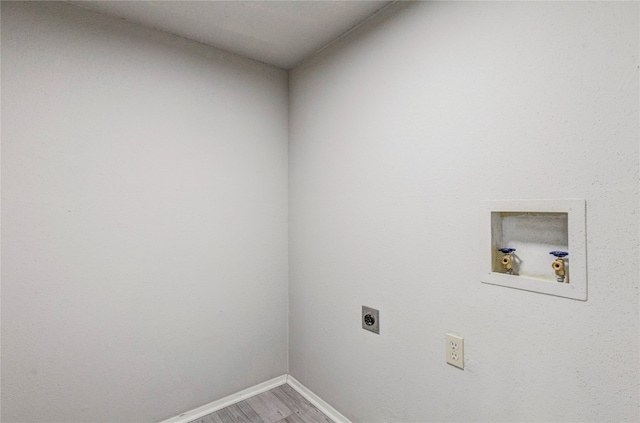 washroom featuring washer hookup, hardwood / wood-style floors, and electric dryer hookup