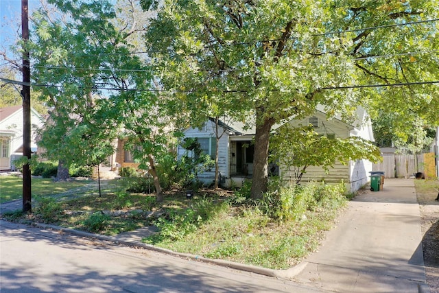 view of property hidden behind natural elements