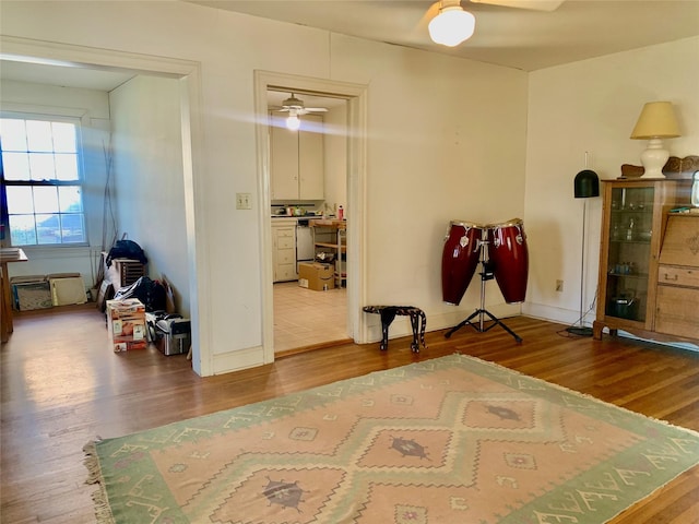 miscellaneous room featuring ceiling fan and hardwood / wood-style floors