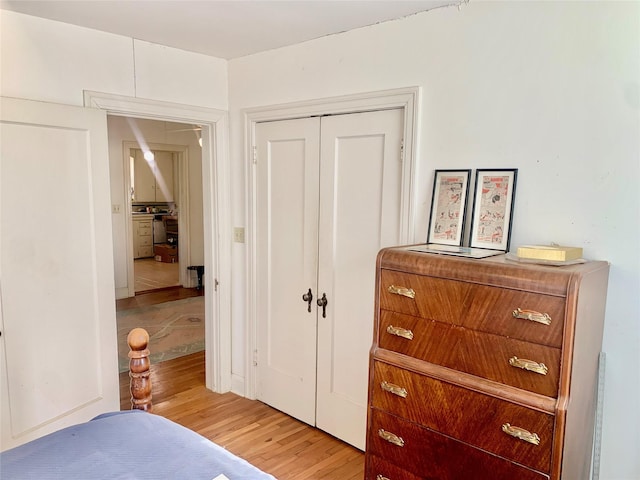 bedroom featuring light hardwood / wood-style flooring and a closet