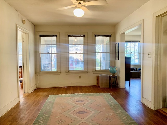 spare room featuring hardwood / wood-style floors and ceiling fan