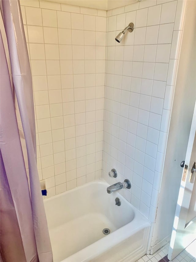 bathroom with shower / tub combo and tile patterned floors