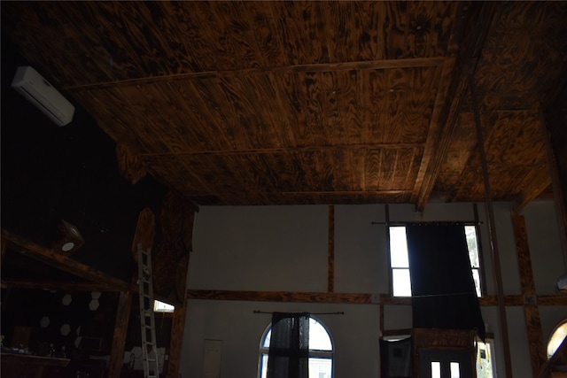 interior details featuring wooden ceiling and a wall unit AC