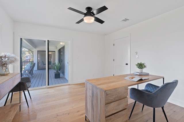 home office featuring light hardwood / wood-style floors and ceiling fan