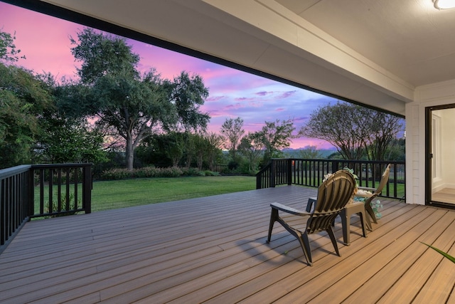 deck at dusk with a lawn