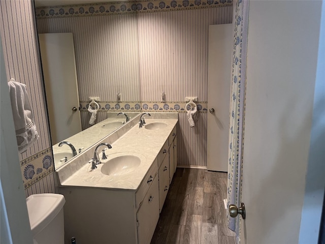 bathroom featuring vanity and hardwood / wood-style flooring