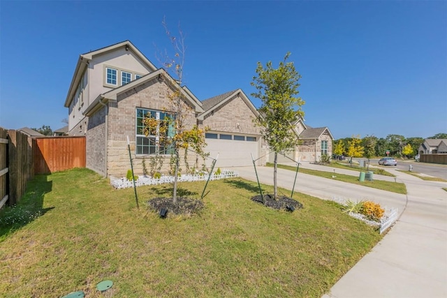 view of front facade with a front yard and a garage