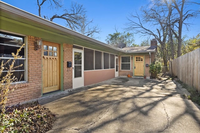 doorway to property with a patio area