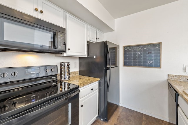 kitchen featuring black appliances, white cabinets, light stone counters, and baseboards