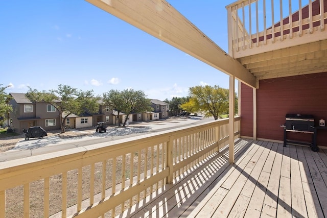 deck featuring a residential view and grilling area