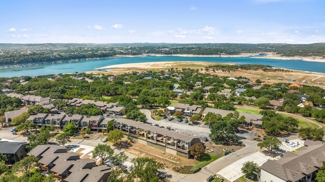 aerial view with a water view and a beach view