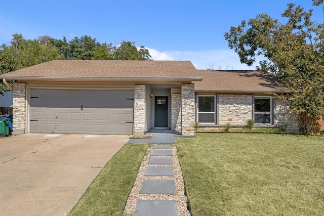 single story home with a garage and a front lawn