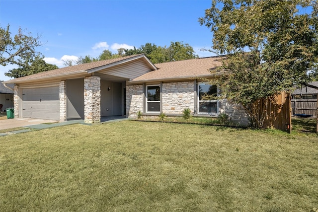 single story home with a front yard and a garage