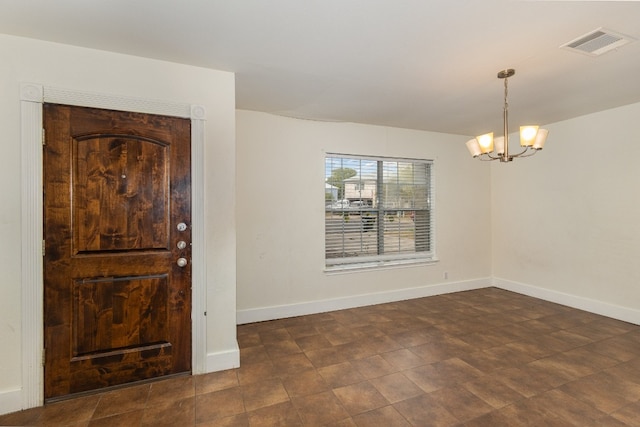 entryway featuring a notable chandelier