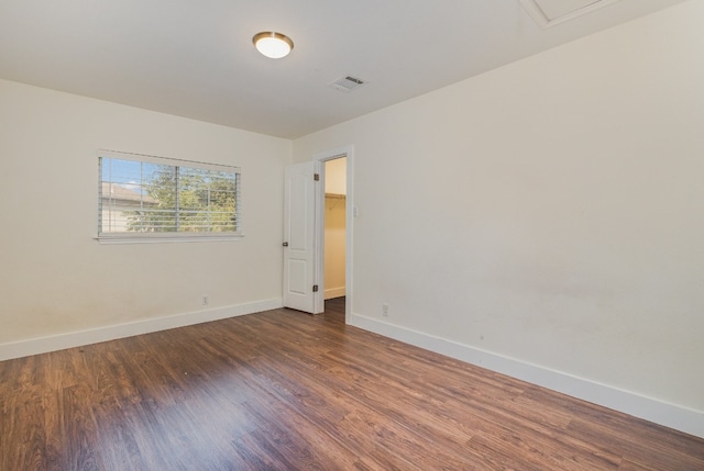 empty room featuring dark wood-type flooring